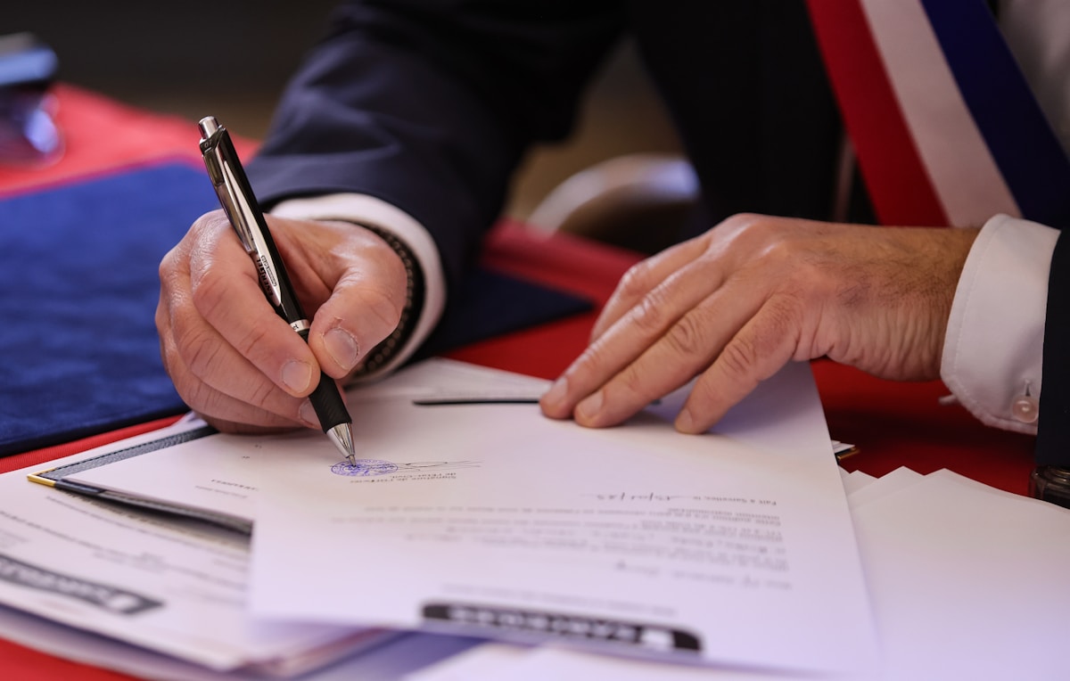 Signing a legal document with a pen